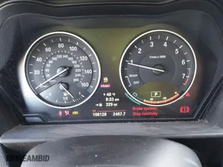 2014 BMW 2 Series 228i with VIN WBA1F5C57EV256067, listed as a IAAI auction lot 41283608 with 108,128 mi miles. Bid and sale history available at carsss.com. Image 7.