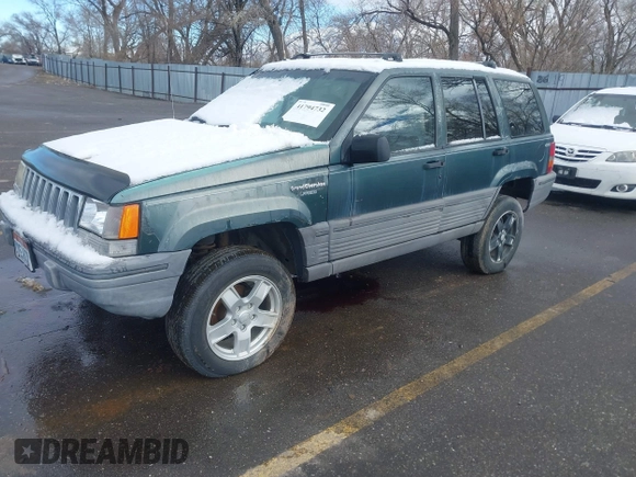 1993 Jeep Grand Cherokee Laredo with VIN 1J4GZ58Y9PC583439, listed as a IAAI auction lot 41794732 with 211,691 mi miles and . Bid and sale history available at DreamBid. Image 2.