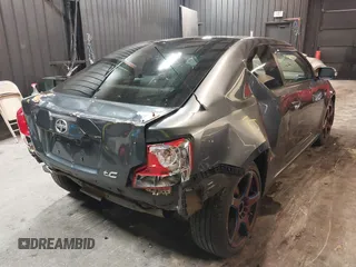 2012 Scion tC with VIN JTKJF5C7XC3034998, listed as a IAAI auction lot 41591632 with 171,121 mi miles. Bid and sale history available at carsss.com. Image 4.
