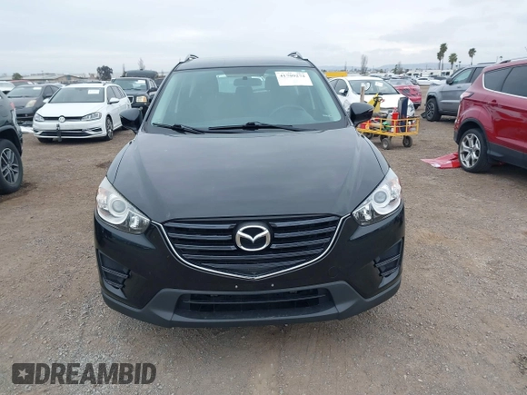 2016 Mazda CX-5 Sport with VIN JM3KE2BY4G0761933, listed as a IAAI auction lot 41709274 with 131,127 mi miles. Bid and sale history available at carsss.com. Image 13.