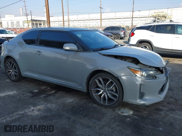 2014 Scion tC with VIN JTKJF5C7XE3079765, listed as a IAAI auction lot 41210220 with 114,410 mi miles. Bid and sale history available at carsss.com. Image 1.