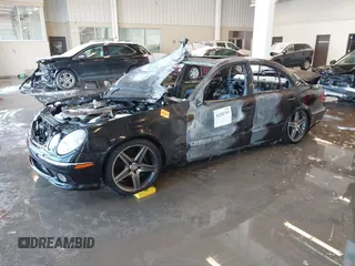 2003 Mercedes-Benz E-Class 5.5L AMG with VIN WDBUF76J73A327193, listed as a IAAI auction lot 41282703 with 1 mi miles. Bid and sale history available at carsss.com. Image 2.