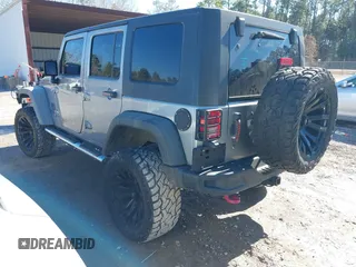 2015 Jeep Wrangler Unlimited Rubicon Hard Rock with VIN 1C4HJWFG2FL587607, listed as a IAAI auction lot 41419237 with 109,719 mi miles and . Bid and sale history available at DreamBid. Image 3.