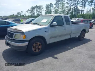 2002 Ford F-150 XL with VIN 1FTRX17W22NA55784, listed as a IAAI auction lot 41958686 with 278,064 mi miles. Bid and sale history available at carsss.com. Image 2.