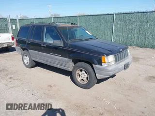 1997 Jeep Grand Cherokee Laredo with VIN 1J4GZ58S4VC633205, listed as a IAAI auction lot 41727571 with 201,228 mi miles. Bid and sale history available at carsss.com. Image 1.