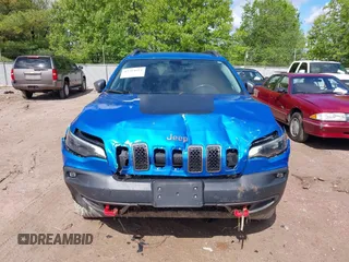 2020 Jeep Cherokee Trailhawk with VIN 1C4PJMBXXLD636547, listed as a IAAI auction lot 42314654 with 59,061 mi miles and . Bid and sale history available at DreamBid. Image 12.