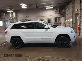 2015 Jeep Grand Cherokee Laredo with VIN 1C4RJFAG4FC660665, listed as a IAAI auction lot 41529532 with 124,099 mi miles. Bid and sale history available at carsss.com. Image 13.