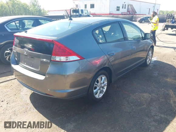 2010 Honda Insight EX with VIN JHMZE2H72AS021555, listed as a IAAI auction lot 42129289 with 172,829 mi miles and . Bid and sale history available at DreamBid. Image 4.