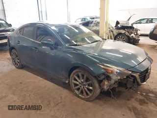 2018 Mazda 3 Grand Touring z VIN 3MZBN1W36JM201060, wystawiony jako IAAI lot #41631841 z przebiegiem 125 198 mil mil oraz . Historia ofert i sprzedaży dostępna na DreamBid. Obrazek 1.