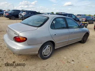 1999 Hyundai Elantra z VIN KMHJF25F1XU777099, wystawiony jako Copart lot #58870035 z przebiegiem 69 470 mil mil oraz Czysty tytuł • Clean title. Historia ofert i sprzedaży dostępna na DreamBid. Obrazek 3.