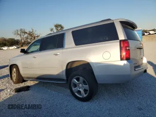 2020 Chevrolet Suburban Premier with VIN 1GNSCJKC9LR198484, listed as a Copart auction lot 87354514 with 115,008 mi miles and Salvage title. Bid and sale history available at DreamBid. Image 2.