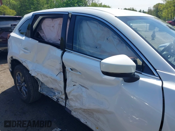 2021 Mazda CX-9 Touring z VIN JM3TCBCYXM0521323, wystawiony jako IAAI lot #42190976 z przebiegiem 56 652 mil mil oraz . Historia ofert i sprzedaży dostępna na DreamBid. Obrazek 6.