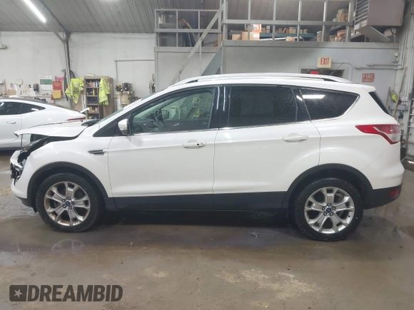 2014 Ford Escape Titanium with VIN 1FMCU9J90EUD21552, listed as a IAAI auction lot 42102148 with 183,539 mi miles. Bid and sale history available at carsss.com. Image 14.