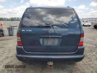 2000 Mercedes-Benz M 320/430/500 with VIN 4JGAB72E7YA168445, listed as a Copart auction lot 59401235 with 231,591 mi miles and Salvage title. Bid and sale history available at DreamBid. Image 6.