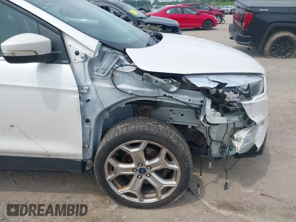 2019 Ford Escape Titanium with VIN 1FMCU9J90KUA86338, listed as a IAAI auction lot 42690159 with 115,891 mi miles and . Bid and sale history available at DreamBid. Image 18.