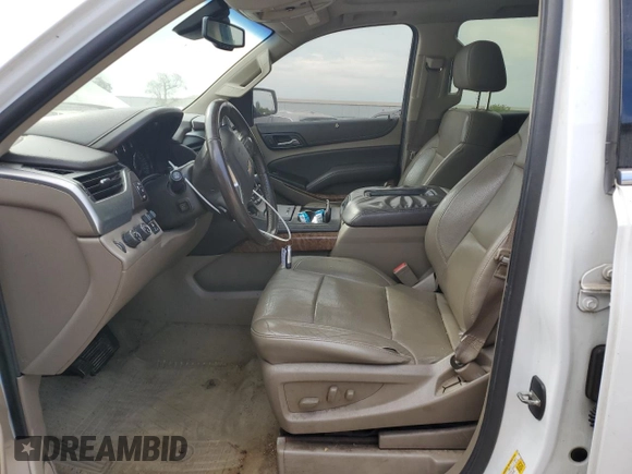 2015 Chevrolet Tahoe LTZ with VIN 1GNSKCKC1FR310018, listed as a Copart auction lot 71798454 with 244,179 mi miles and Salvage title. Bid and sale history available at DreamBid. Image 7.