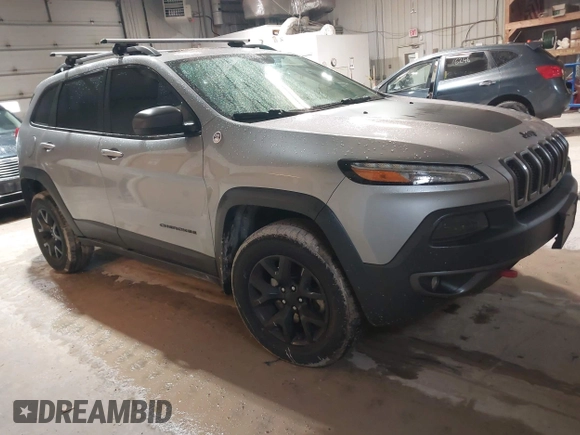 2014 Jeep Cherokee Trailhawk z VIN 1C4PJMBS4EW254963, wystawiony jako IAAI lot #42065845 z przebiegiem 187 356 mil mil oraz . Historia ofert i sprzedaży dostępna na DreamBid. Obrazek 1.