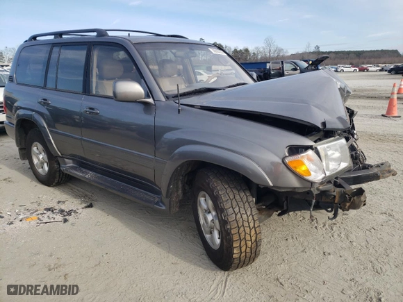 2000 Toyota Land Cruiser with VIN JT3HT05J3Y0088425, listed as a Copart auction lot 41387034 with 243,408 mi miles and Salvage Title. Bid and sale history available at carsss.com. Image 4.