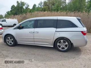 2012 Honda Odyssey Touring with VIN 5FNRL5H92CB055473, listed as a IAAI auction lot 42128601 with 163,901 mi miles. Bid and sale history available at carsss.com. Image 14.