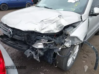 2013 Volkswagen Tiguan SE z VIN WVGBV7AX7DW501335, wystawiony jako IAAI lot #41856816 z przebiegiem 129 615 mil mil oraz . Historia ofert i sprzedaży dostępna na DreamBid. Obrazek 6.