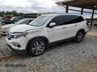 2017 Honda Pilot Touring z VIN 5FNYF6H92HB067140, wystawiony jako Copart lot #55757925 z przebiegiem 132 425 mil mil oraz Szkoda całkowita • Salvage title. Historia ofert i sprzedaży dostępna na DreamBid. Obrazek 1.