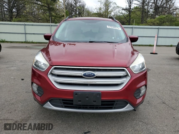2018 Ford Escape SE z VIN 1FMCU9GD7JUB01668, wystawiony jako Copart lot #57038675 z przebiegiem 70 780 mil mil oraz Szkoda całkowita • Salvage title. Historia ofert i sprzedaży dostępna na DreamBid. Obrazek 5.