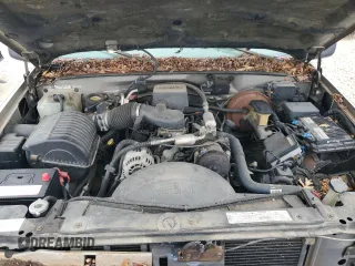1999 GMC Yukon with VIN 1GKEK13R5XJ767903, listed as a Copart auction lot 84158844 with 112,229 mi miles and Salvage Title. Bid and sale history available at carsss.com. Image 12.