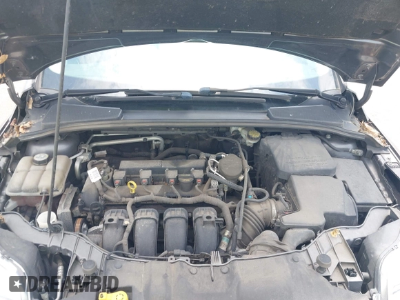 2012 Ford Focus SE z VIN 1FAHP3F21CL463413, wystawiony jako IAAI lot #42564350 z przebiegiem 115 849 mil mil oraz . Historia ofert i sprzedaży dostępna na DreamBid. Obrazek 10.