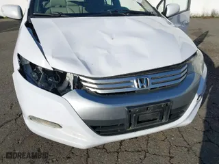 2010 Honda Insight EX with VIN JHMZE2H7XAS015986, listed as a IAAI auction lot 41229343 with 137,276 mi miles. Bid and sale history available at carsss.com. Image 6.