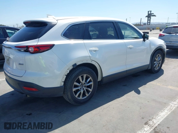 2019 Mazda CX-9 Touring with VIN JM3TCACY5K0306424, listed as a IAAI auction lot 42150466 with 95,166 mi miles and . Bid and sale history available at DreamBid. Image 4.