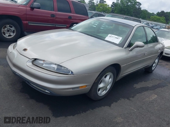 1997 Oldsmobile Aurora z VIN 1G3GR62CXV4121200, wystawiony jako IAAI lot #42277003 z przebiegiem 198 048 mil mil oraz . Historia ofert i sprzedaży dostępna na DreamBid. Obrazek 2.