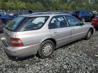 1997 Honda Accord EX with VIN 1HGCE189XVA001554, listed as a Copart auction lot 71355014 with 217,696 mi miles and Salvage Title. Bid and sale history available at carsss.com. Image 3.