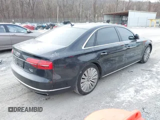 2015 Audi A8 L 4.0T with VIN WAU32AFD7FN006233, listed as a IAAI auction lot 41353034 with 119,693 mi miles. Bid and sale history available at carsss.com. Image 4.