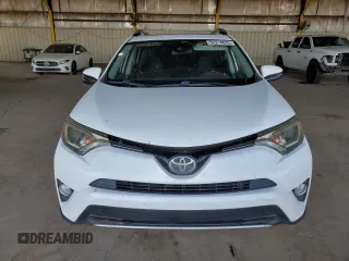 2018 Toyota RAV4 XLE with VIN JTMWFREV2JJ740145, listed as a Copart auction lot 52214075 with 129,940 mi miles and Salvage title. Bid and sale history available at DreamBid. Image 5.