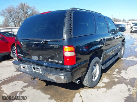 2003 Chevrolet Tahoe LS with VIN 1GNEC13V63R245581, listed as a IAAI auction lot 41599241 with 234,028 mi miles. Bid and sale history available at carsss.com. Image 4.