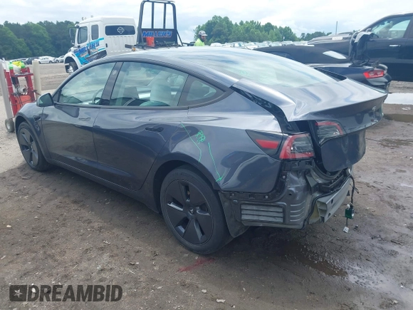2023 Tesla Model 3 with VIN 5YJ3E1EAXPF628911, listed as a IAAI auction lot 42362410 with 25,387 mi miles and . Bid and sale history available at DreamBid. Image 3.