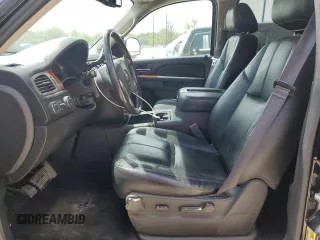 2014 Chevrolet Suburban LT with VIN 1GNSKJE77ER193143, listed as a Copart auction lot 54311935 with 171,407 mi miles and Salvage Title. Bid and sale history available at DreamBid. Image 7.