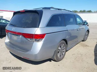 2016 Honda Odyssey Touring Elite with VIN 5FNRL5H91GB158499, listed as a IAAI auction lot 41899037 with 119,364 mi miles. Bid and sale history available at carsss.com. Image 4.