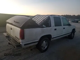 1996 Chevrolet Suburban z VIN 3GNFK16R7TG124404, wystawiony jako Copart lot #77361264 z przebiegiem 256 935 mil mil oraz Szkoda całkowita • Salvage title. Historia ofert i sprzedaży dostępna na DreamBid. Obrazek 3.