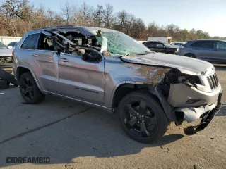 2015 Jeep Grand Cherokee Altitude with VIN 1C4RJFAG0FC136039, listed as a Copart auction lot 89237525 with 124,374 mi miles and Salvage Title. Bid and sale history available at carsss.com. Image 4.