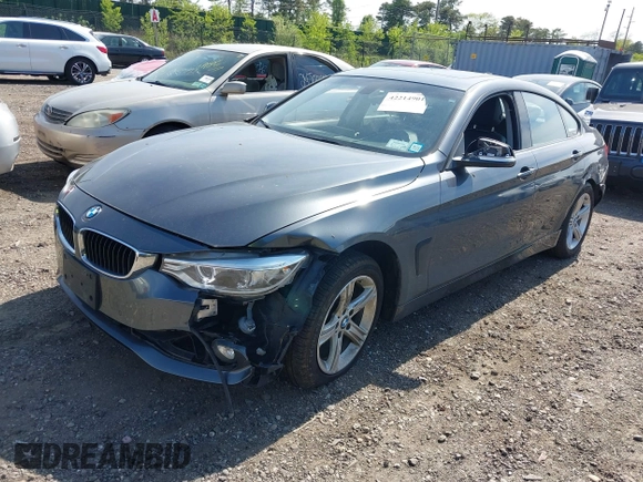 2015 BMW 4 Series 428i xDrive with VIN WBA4C9C55FD331921, listed as a IAAI auction lot 42214901 with 94,970 mi miles and . Bid and sale history available at DreamBid. Image 2.