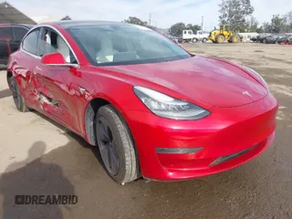 2020 Tesla Model 3 Standard Range Plus with VIN 5YJ3E1EA9LF718027, listed as a IAAI auction lot 41679320 with 68,987 mi miles. Bid and sale history available at carsss.com. Image 1.