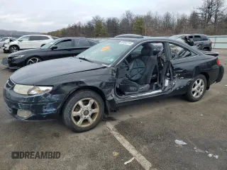 2000 Toyota Solara SE z VIN 2T1CF22P7YC350633, wystawiony jako Copart lot #86302214 z przebiegiem 148 431 mil mil oraz Szkoda całkowita • Salvage title. Historia ofert i sprzedaży dostępna na DreamBid. Obrazek 1.