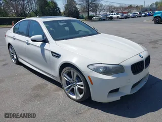 2013 BMW M5 with VIN WBSFV9C58DC773268, listed as a IAAI auction lot 41890830 with 128,399 mi miles. Bid and sale history available at carsss.com. Image 1.