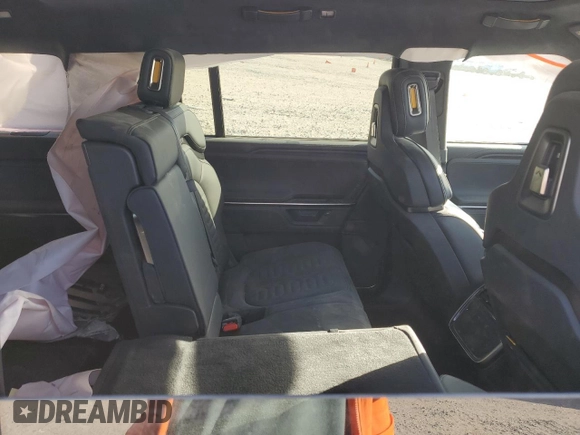 2025 Rivian R1S Adventure z VIN 7PDSGBBA5SN045424, wystawiony jako Copart lot #49675655 z przebiegiem Nie podano mil oraz Szkoda całkowita • Salvage title. Historia ofert i sprzedaży dostępna na DreamBid. Obrazek 11.