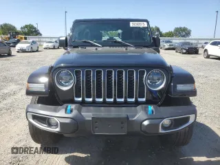 2023 Jeep Wrangler Sahara with VIN 1C4JJXP61PW512975, listed as a Copart auction lot 59392075 with 26,954 mi miles and Salvage title. Bid and sale history available at DreamBid. Image 5.