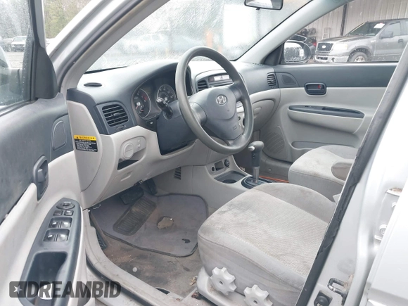 2006 Hyundai Accent GLS with VIN KMHCN46C46U035208, listed as a IAAI auction lot 41769016 with 141,065 mi miles. Bid and sale history available at carsss.com. Image 5.