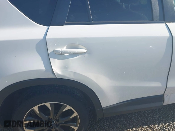 2016 Mazda CX-5 Grand Touring with VIN JM3KE4DY1G0680431, listed as a IAAI auction lot 42136637 with 166,348 mi miles. Bid and sale history available at carsss.com. Image 20.
