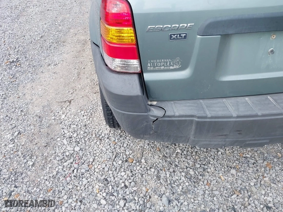 2007 Ford Escape XLT with VIN 1FMYU03107KA50631, listed as a IAAI auction lot 41374784 with 174,870 mi miles. Bid and sale history available at carsss.com. Image 6.