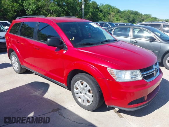 2015 Dodge Journey SE z VIN 3C4PDCAB5FT679585, wystawiony jako IAAI lot #42090600 z przebiegiem 166 876 mil mil oraz . Historia ofert i sprzedaży dostępna na DreamBid. Obrazek 1.